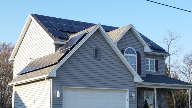 Solar panels on the roof of a house and garage