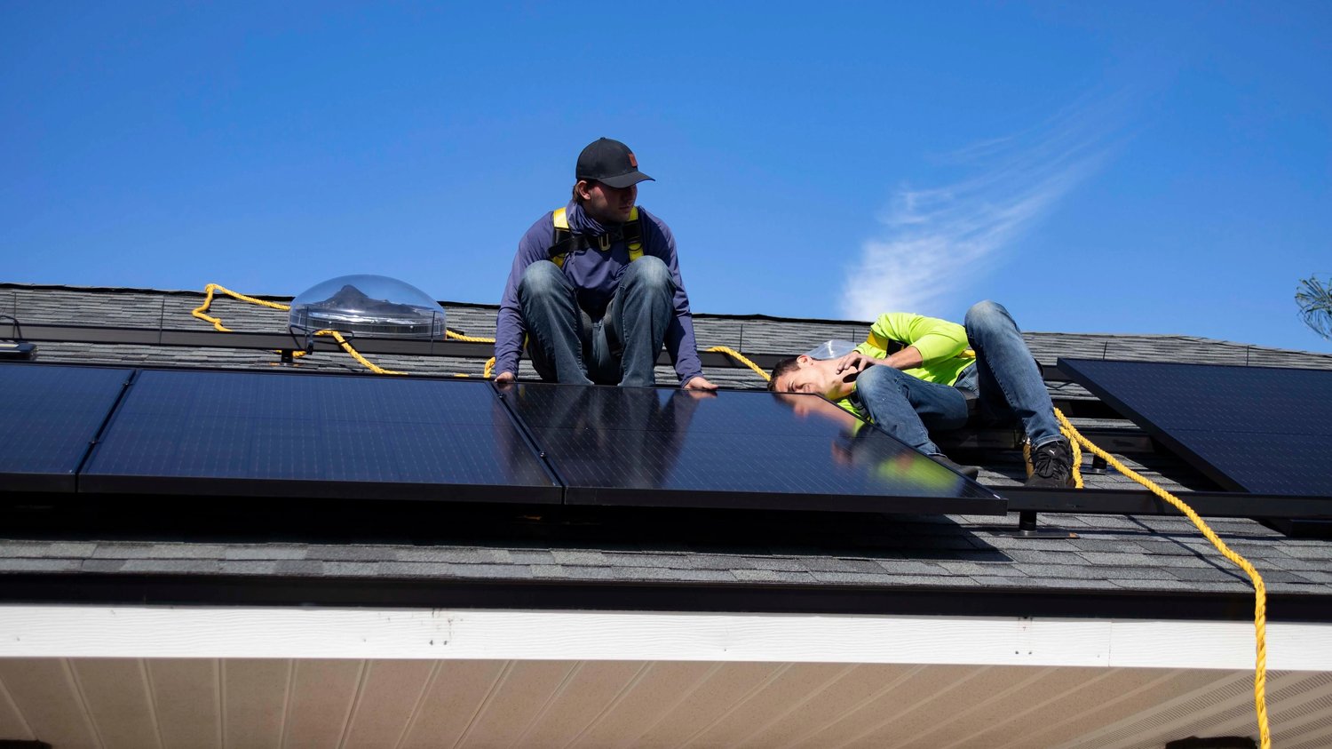 men installing solar panels